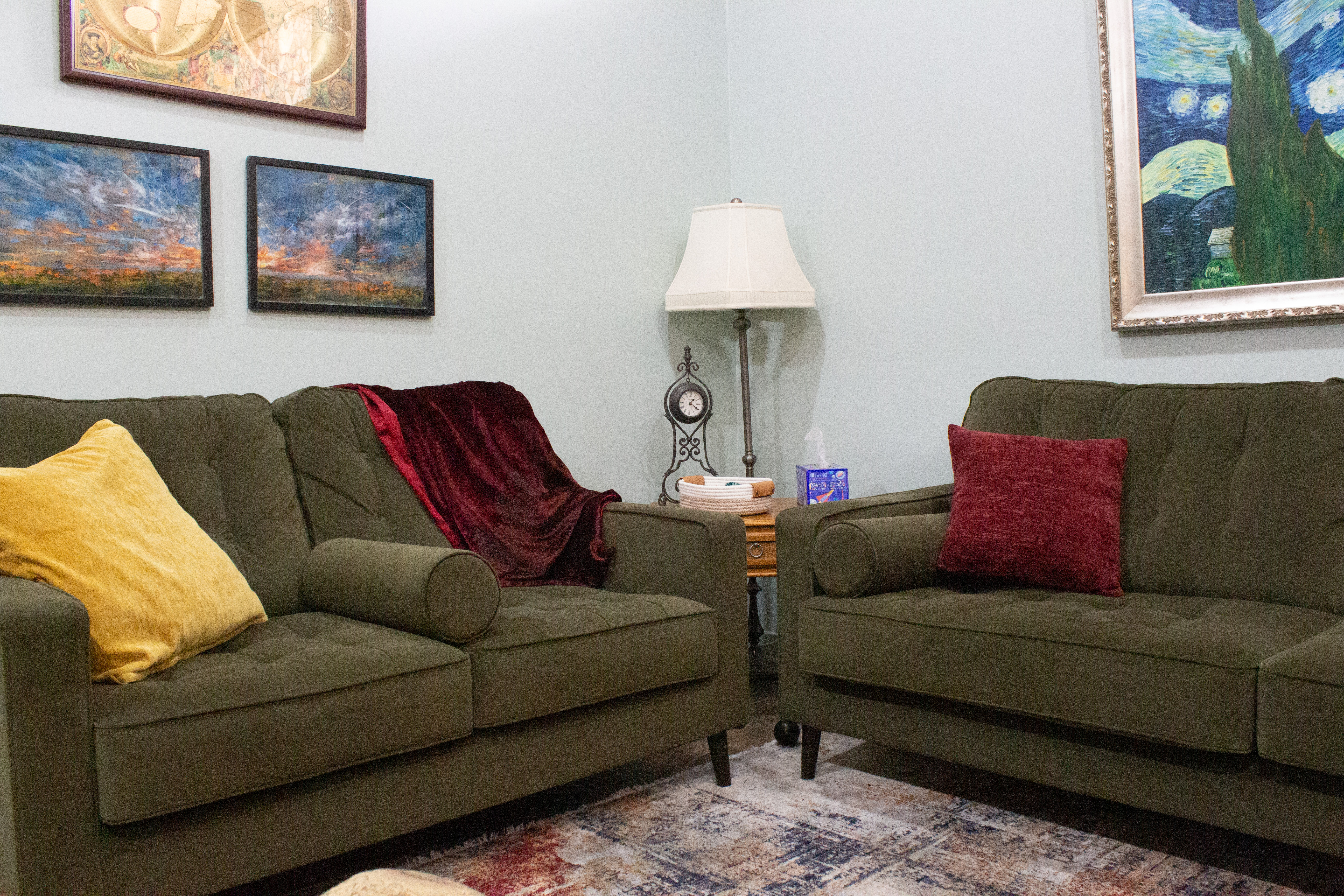 Cozy therapy room with couches at Fourth Wall Wellness